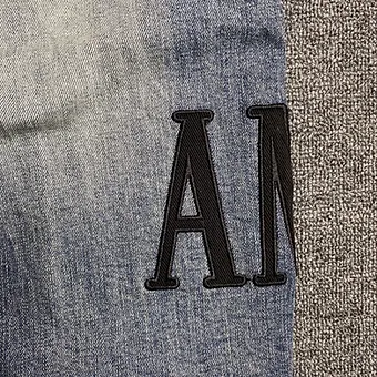 Amiri jeans blue black logo side
