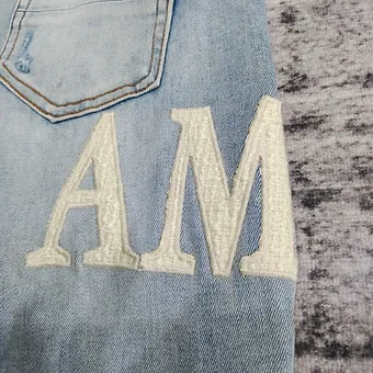 Amiri jeans baby blue side logo