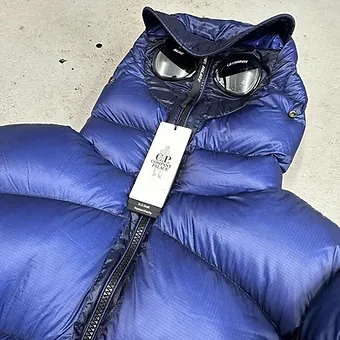cad729_fb5701005cae4444bb404f970e025dd3~mv2 Cp Company x Palace Puffer